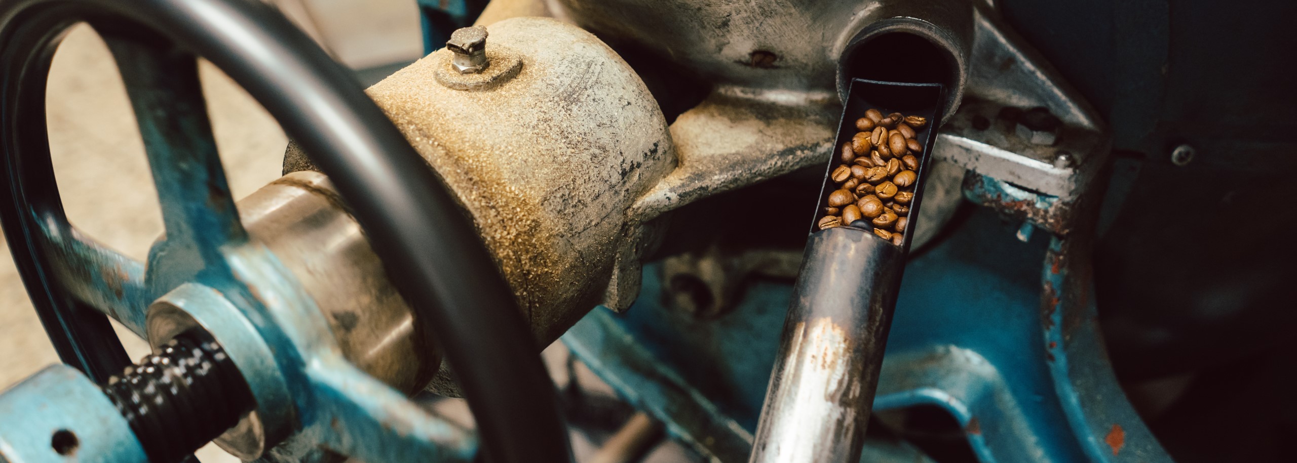Sample being taken out of coffee roaster