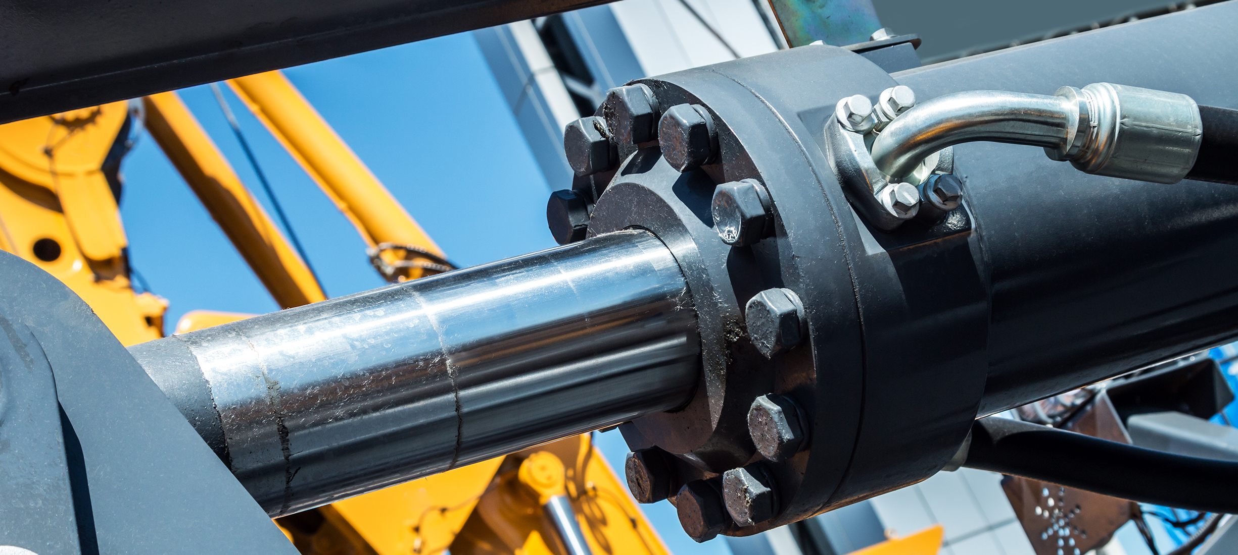 Hydraulikzylinder im Sondermaschinenbau Hydraulikzylinder eines Baumaschinensystems – Symbolbild für Sonderschrauben, Verbindungselemente und Baugruppen der Stahlberg GmbH im Bereich Hydraulik.